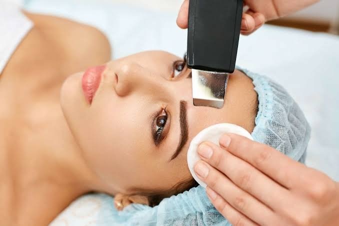 Ultrasonic skin scrubber facial deep pore cleansing treatment at Nail Bahar salon.