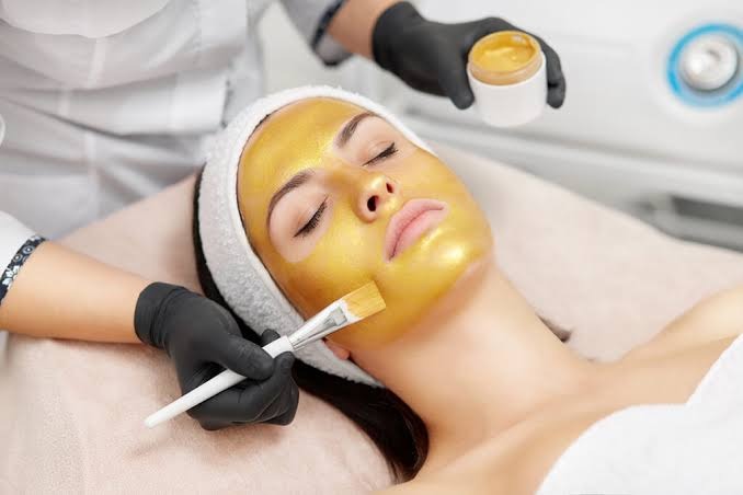 24K gold mask anti-aging facial treatment at Nail Bahar salon.